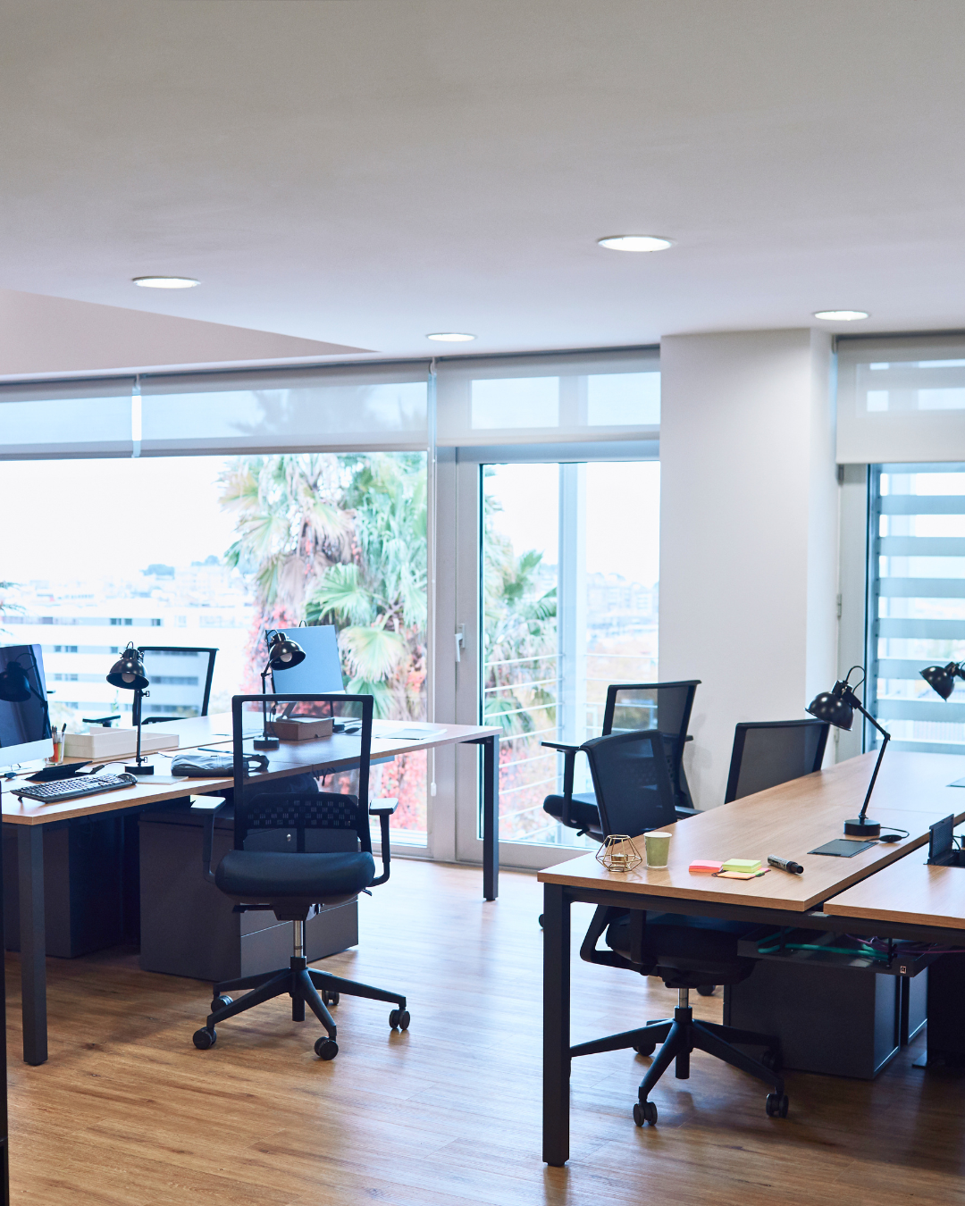 Bright managed office workstations with lounge seating and skyline views in Hyderabad