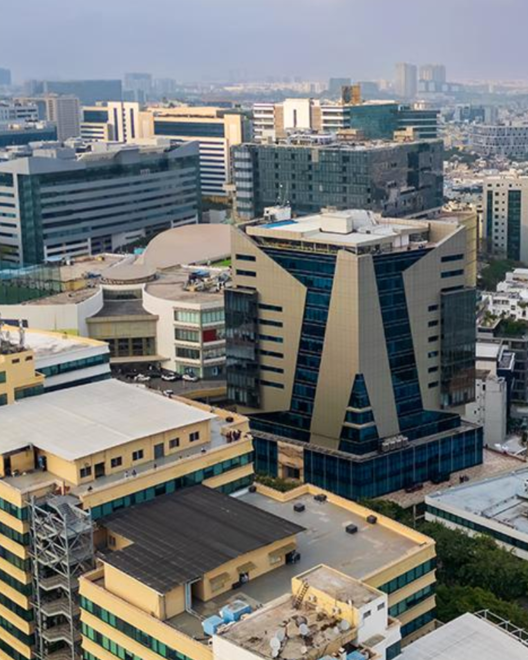 Modern Grade A office tower rising above Hyderabad's western business corridor