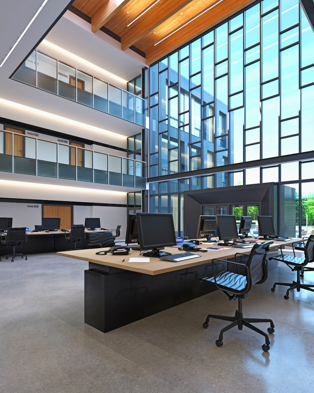 Premium open-plan office interior with double-height glazing and city views