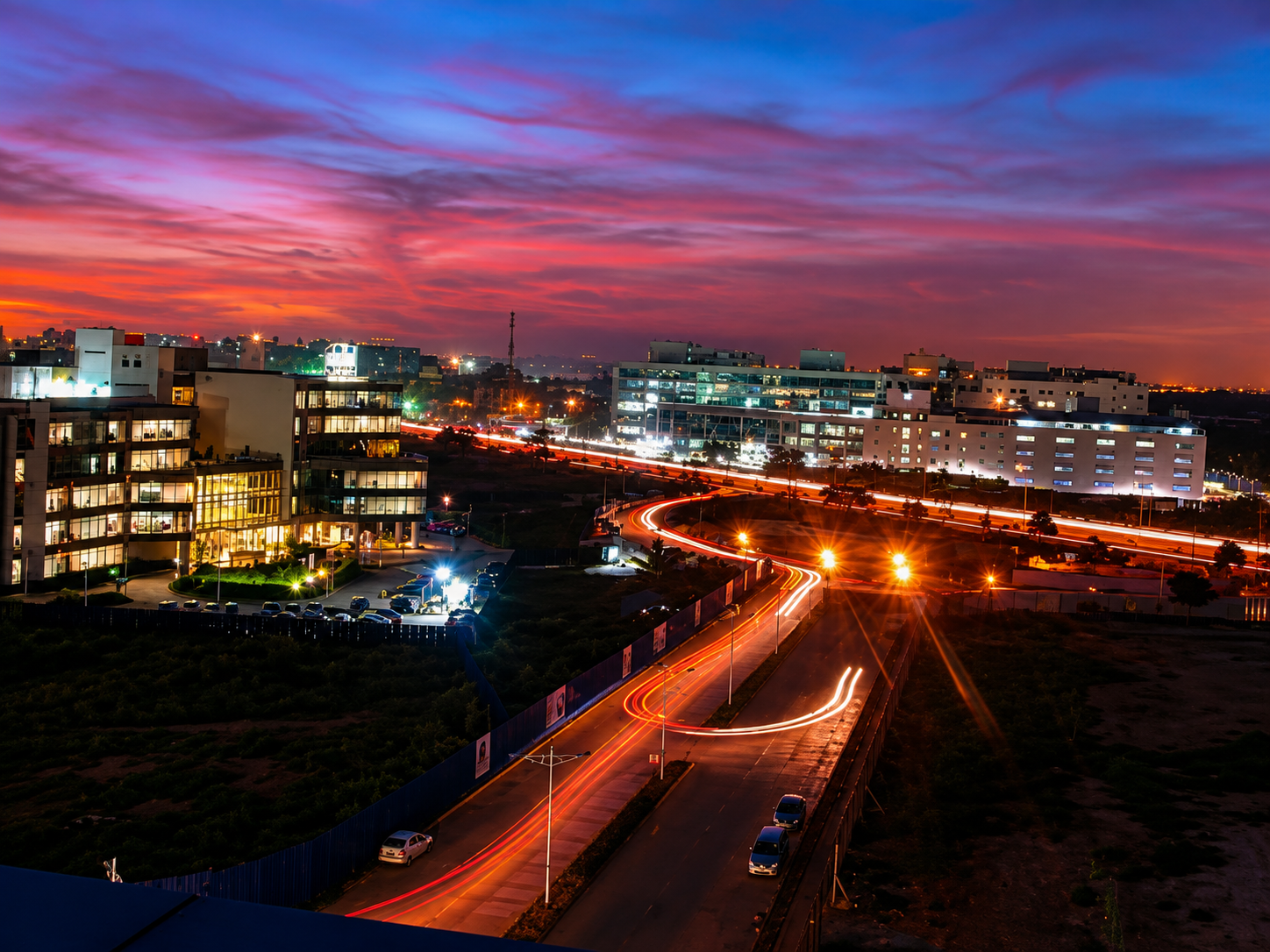 Bengaluru business district skyline and expressway at dusk, connecting the city's key office corridors