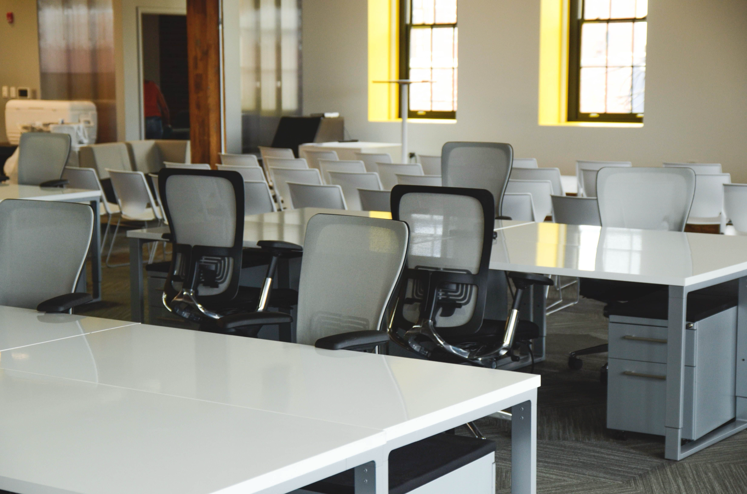 Bright office with desks, chairs and natural light
