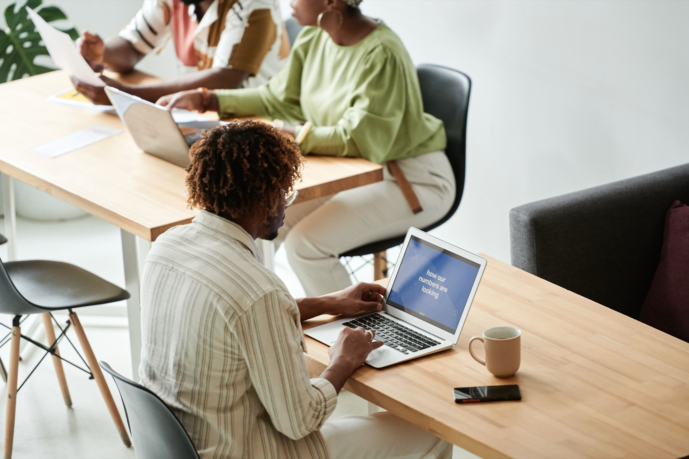 Colleagues meeting in a bright meeting room in a managed office